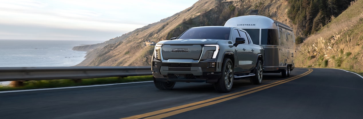 Gray Electric Vehicle Truck on mountain road